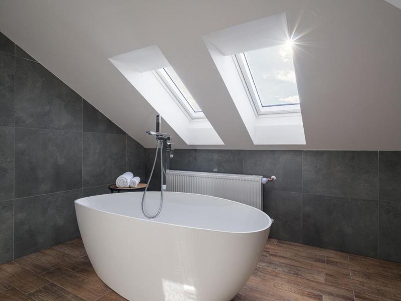 Freestanding bath under skylights