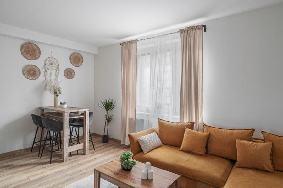 Open-plan living and dining area with sofa and dining table